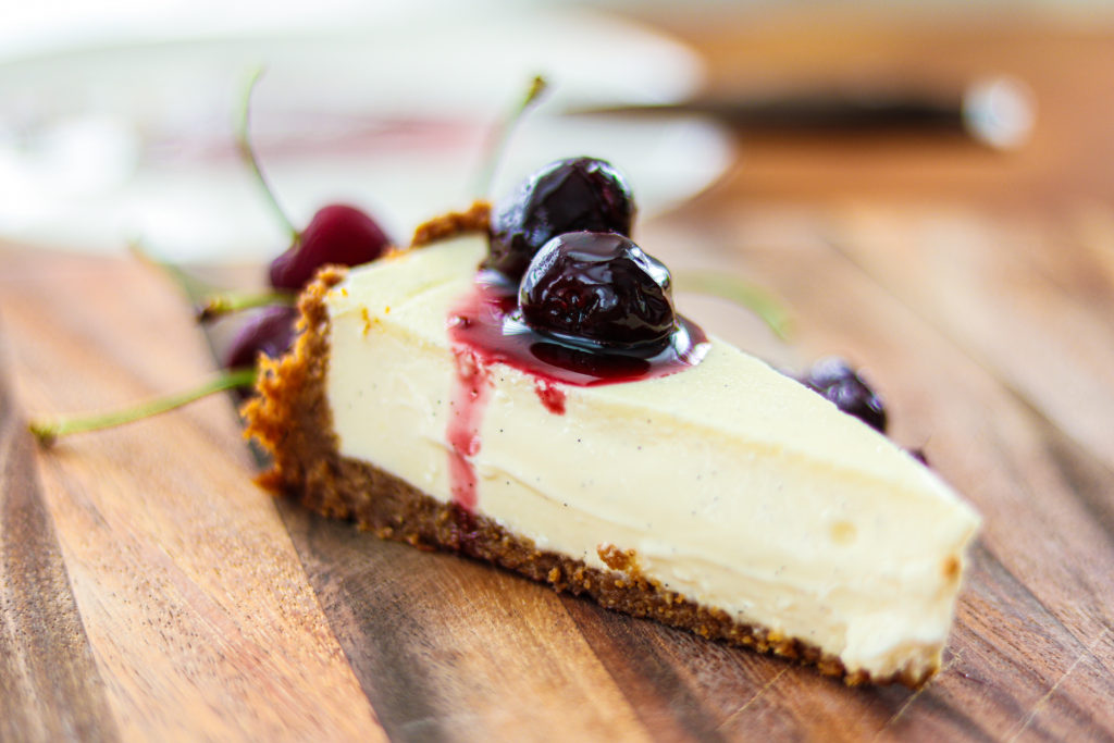 A slice of gluten free cheesecake with cherries by sisters sans gluten