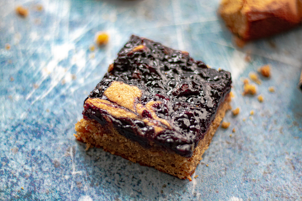 Close up of a gluten free peanut butter and jelly bar by sisters sans gluten