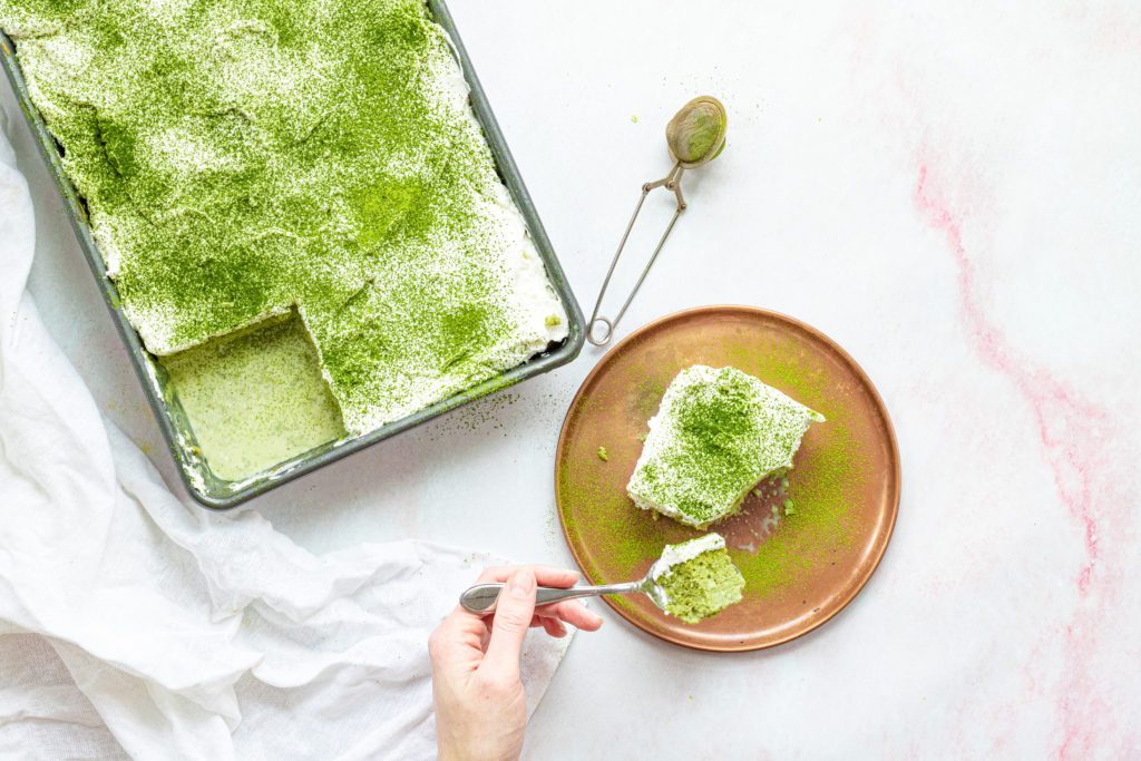 Slice of gluten free matcha tres leches cake by Sisters Sans Gluten
