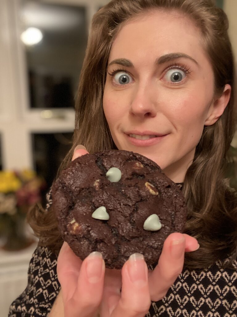 holding a gluten free chocolate mint chip cookie